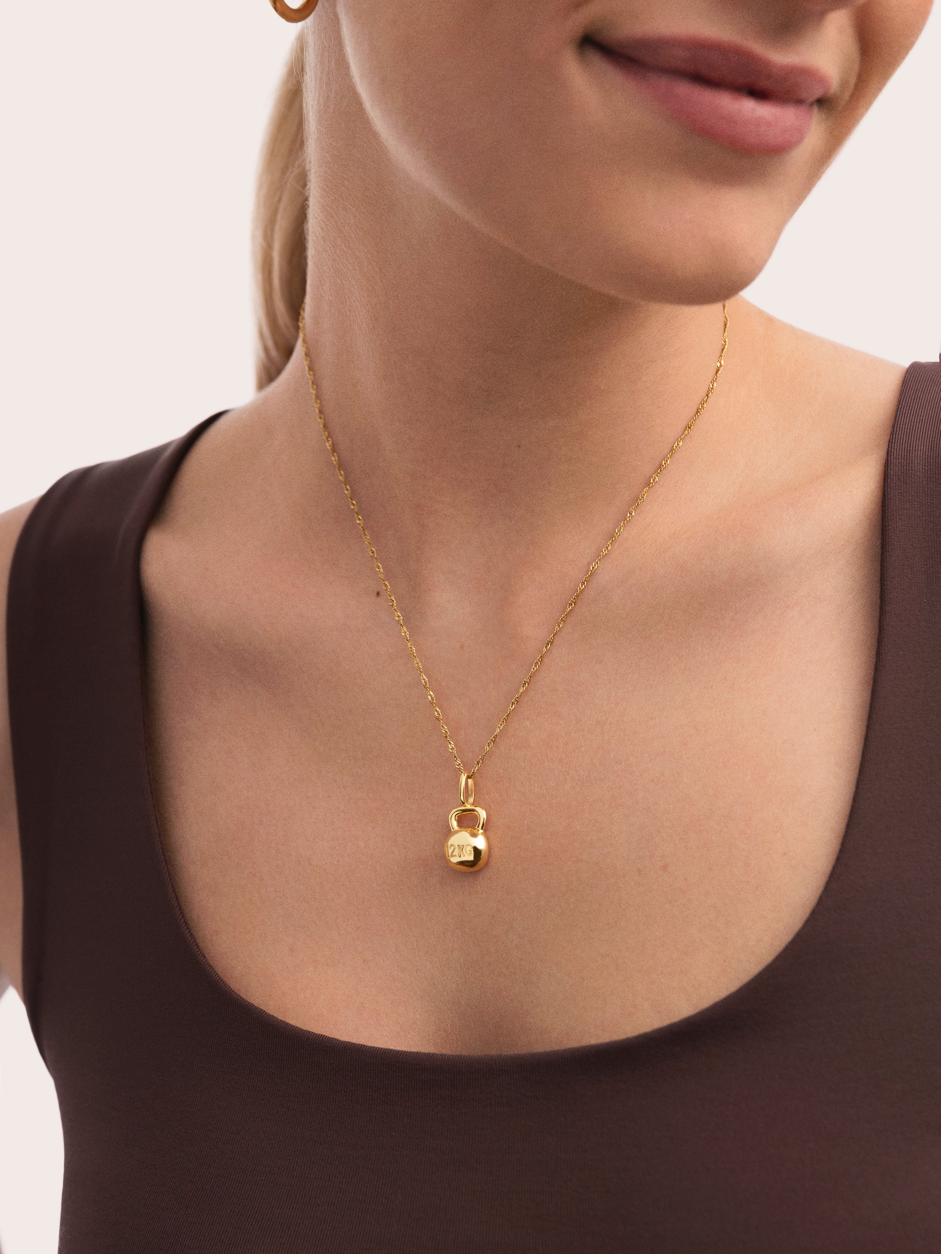 Charm Kettlebell Baño Oro